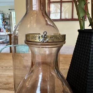 Metal bangle bracelet with anchor embellishment